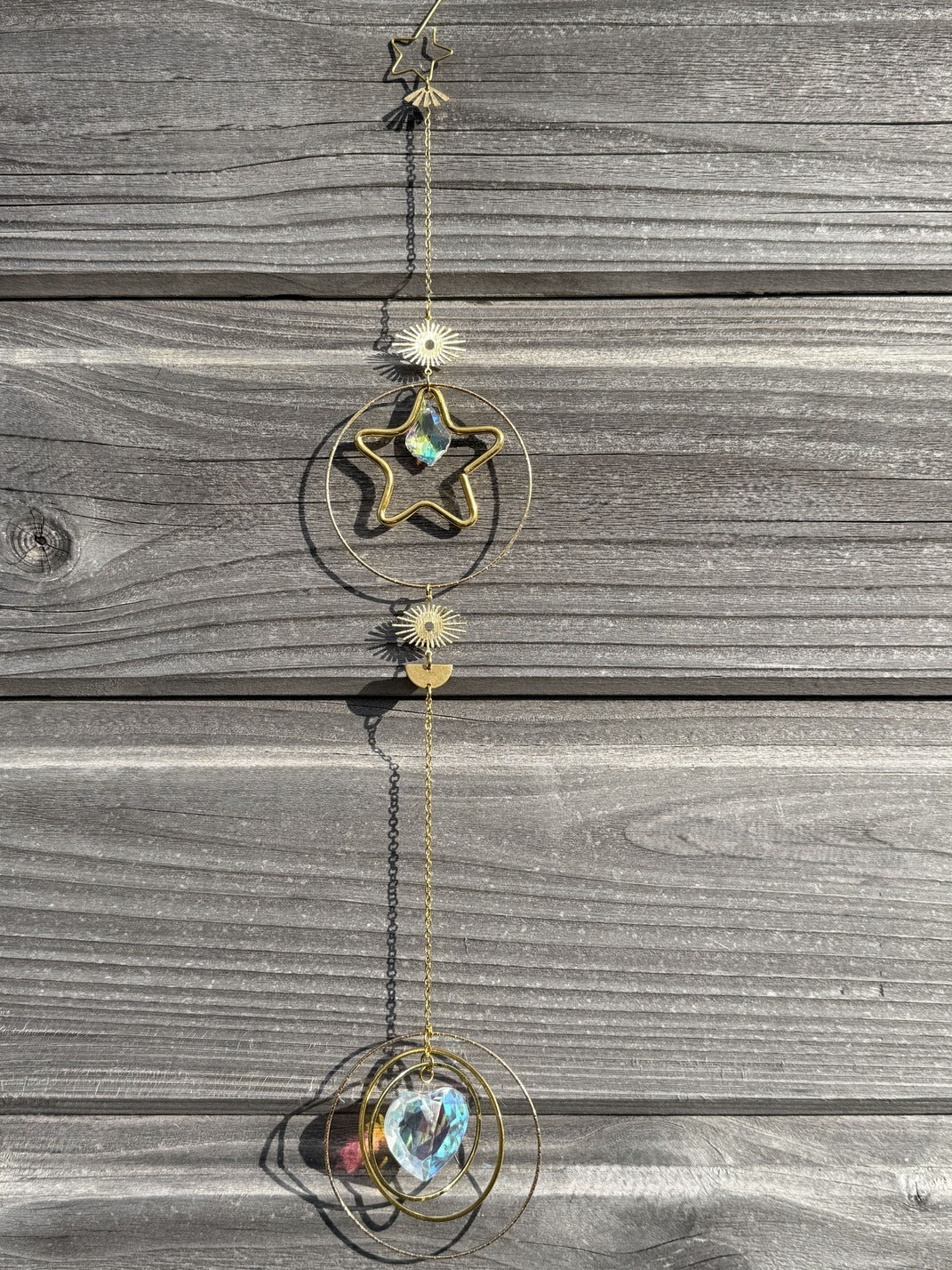 EROS Attrape-Soleil - Détail cristal cœur étoile symboles dorés feng shui
